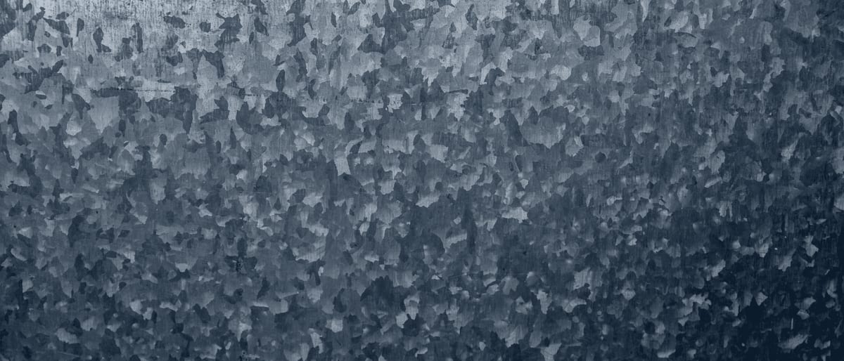 Brushed raw steel surface in close texture.
